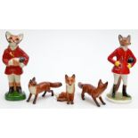 Three Beswick small foxes, two walking, one seated, together with two Huntmaster fox models,