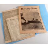 A reprint Titanic newspaper and other newspapers.