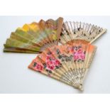 An eastern painted fan with bone and bamboo sticks, and two other fans.