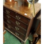 An early George III mahogany chest with a brushing slide above four graduated cock beaded drawers