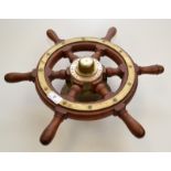 A hardwood brass mounted boat wheel, marked "SRS.