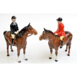 A pair of Beswick equestrian huntsman and huntswoman (brown horse) figures.

 Condition Report: