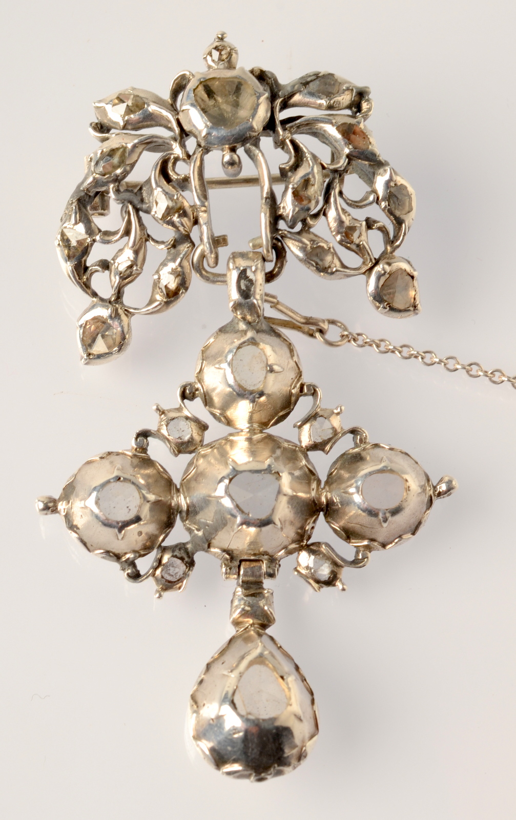 An antique continental, diamond set pendant cross, now mounted as a brooch,