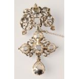 An antique continental, diamond set pendant cross, now mounted as a brooch,