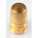 A gold thimble.