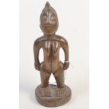 An antique African tribal carved wood figure.