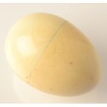 An ivory, egg form box.  Condition Report: The length is 3.5cm.