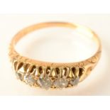 An 18ct. gold ring claw set with five diamonds.