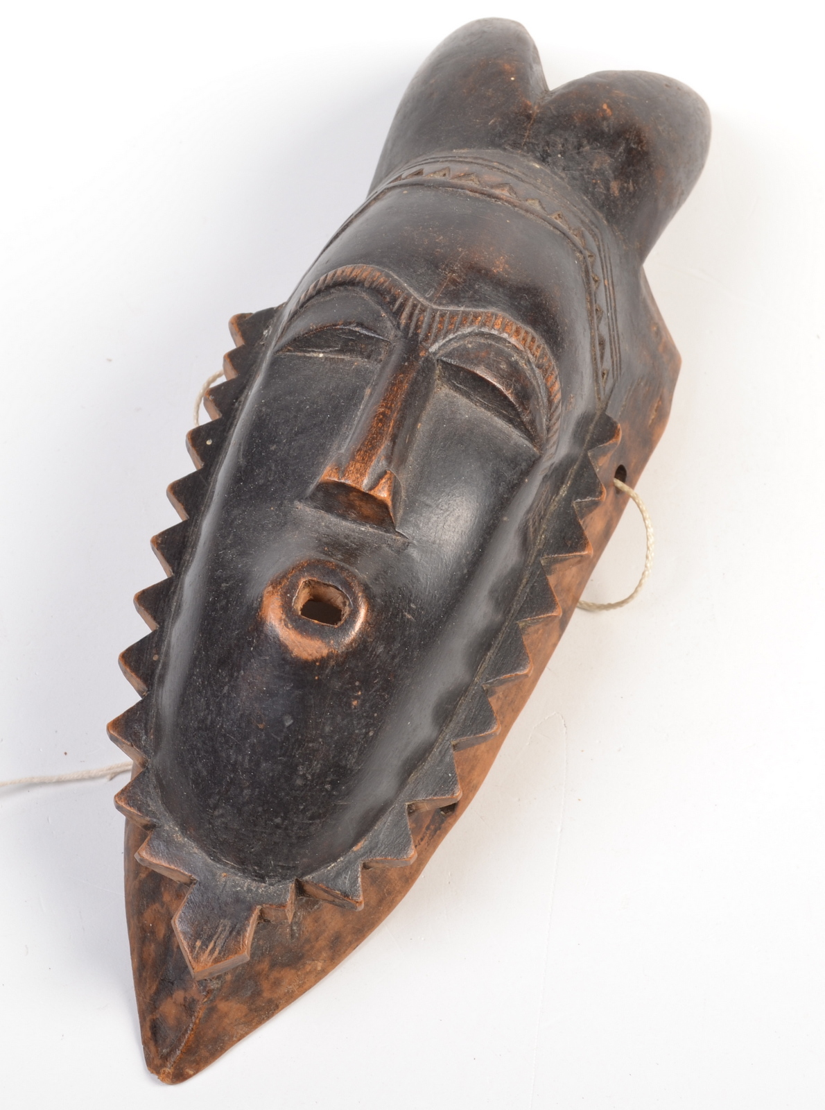 An African tribal horned mask.