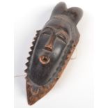 An African tribal horned mask.