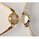 A ladies Rolex Orchid, white metal cased wristwatch on plated strap and a Tissot ladies wristwatch.