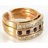 A triple banded 9ct gold ring set with diamonds and amethyst.   Condition Report: The ring is N/O,