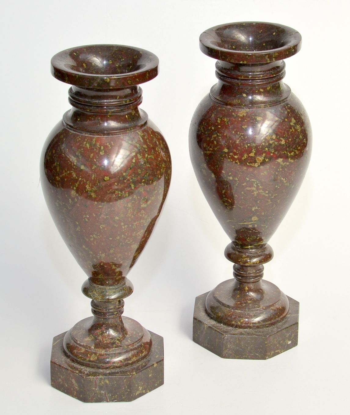 A pair of serpentine vases each with ovoid body and octagonal base. 27.3cm.
