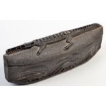 An African carved ebony boat shaped crocodile box with primates to the sides. 36cm.