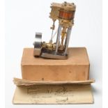 A Stuart Progress model steam engine with vertical single cylinder,