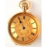 An 18ct. gold keyless, small pocket watch with engraved gold, open face.