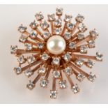 A good diamond and pearl starburst brooch.