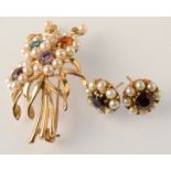 A 9ct. gold flower spray brooch and a pair of 9ct. gold pearl and garnet earrings.