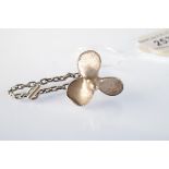 A silver ships' propeller keyring.