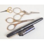 A pair of miniature 19th century scissors, other scissors, a Swan fountain pen etc.