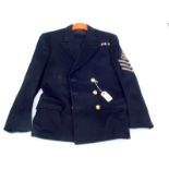 A Royal Navy black wool military jacket with applied arm badges.