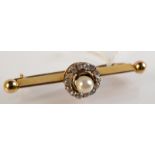 A pearl and diamond bar brooch.