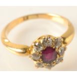 A ruby and diamond cluster ring.