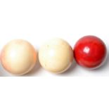 A set of three ivory billiard balls, diameter 1 x 50cm 2 x 52cm, weight 399g.