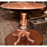 A Victorian walnut, oval, twin flap small table with carved spiral pedestal and quadruple,