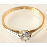 An 18ct. gold and platinum solitaire diamond ring.