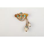 An early Victorian high purity gold brooch set with turquoise and white coral.  Condition Report: