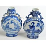 Two Chinese small, blue and white moon flasks.  Condition Report: Both are 5cm high with chips to