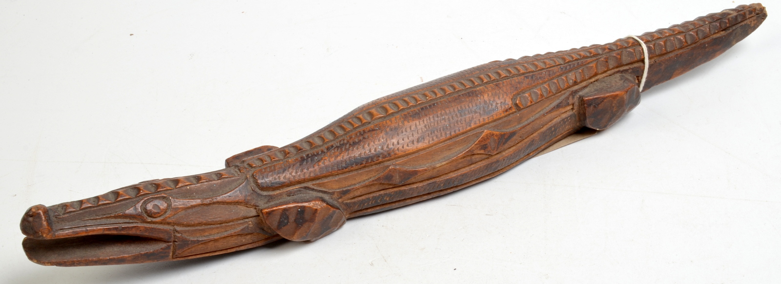 A carved wood prisoner of war crocodile.