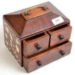 A miniature, three drawer chest with carrying handle,