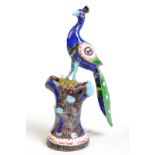 An eastern enamelled and jewelled peacock,  Height 13.5cm.