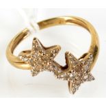 A 9ct double star cross over ring.