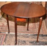 An oval mahogany, twin flap small table in mid 18th century style.