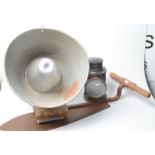 A 1950's external loudspeaker, a railway type hand lantern and a hay knife.