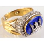 An 18ct. gold heavy diamond ring with a central naval crown on blue enamelled ground. Condition