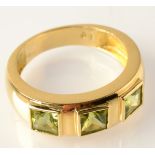 A peridot ring in 18ct. gold.