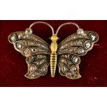 A good 19th century enamelled gold butterfly brooch, set with rose cut diamonds, boxed. Condition