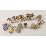 A silver bracelet strung with enamel souvenir shields, 36g.