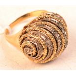 An 18ct. gold diamond snail ring.