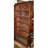 A Globe-Wernicke six section bookcase with glazed doors, width 86cm, height 198cm. Condition Report: