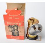 A miners' carbide cap lamp, by the Premier Lamp & Engineering Co Ltd. Unused, original box.
