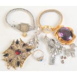 A Victorian gilt amethyst brooch and other jewellery.