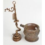 A Tibetan copper vessel and a bronze watch stand.