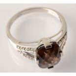 A 9ct. white gold ring set smoky quartz and diamonds.