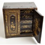 A 19th century Chinese export, gilt, black lacquer cabinet with five drawers behind doors, width 30.