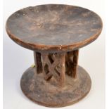 An African tribal pierced wood stool. Diameter 23.5cm, height 19cm.